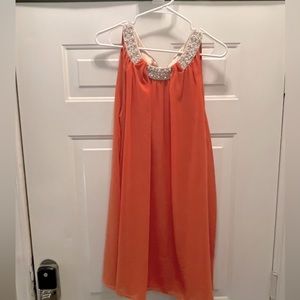 Orange babydoll dress with champagne jeweled collar